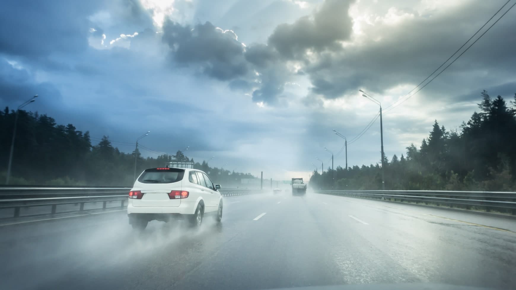 Car Driving on Highway in Rainy Weather